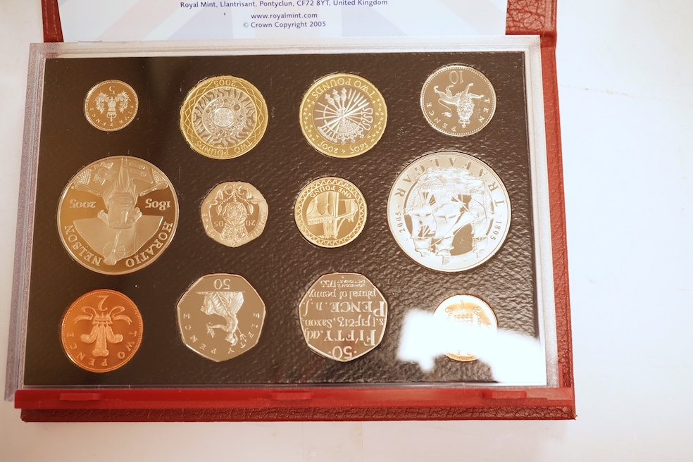 A collection of cased silver and cupro nickel proof and uncirculated sets and coins, including four Royal Mint UK proof coin year sets for 2002-2005, Royal Mint UK silver proof £2, London mint office silver commemorative